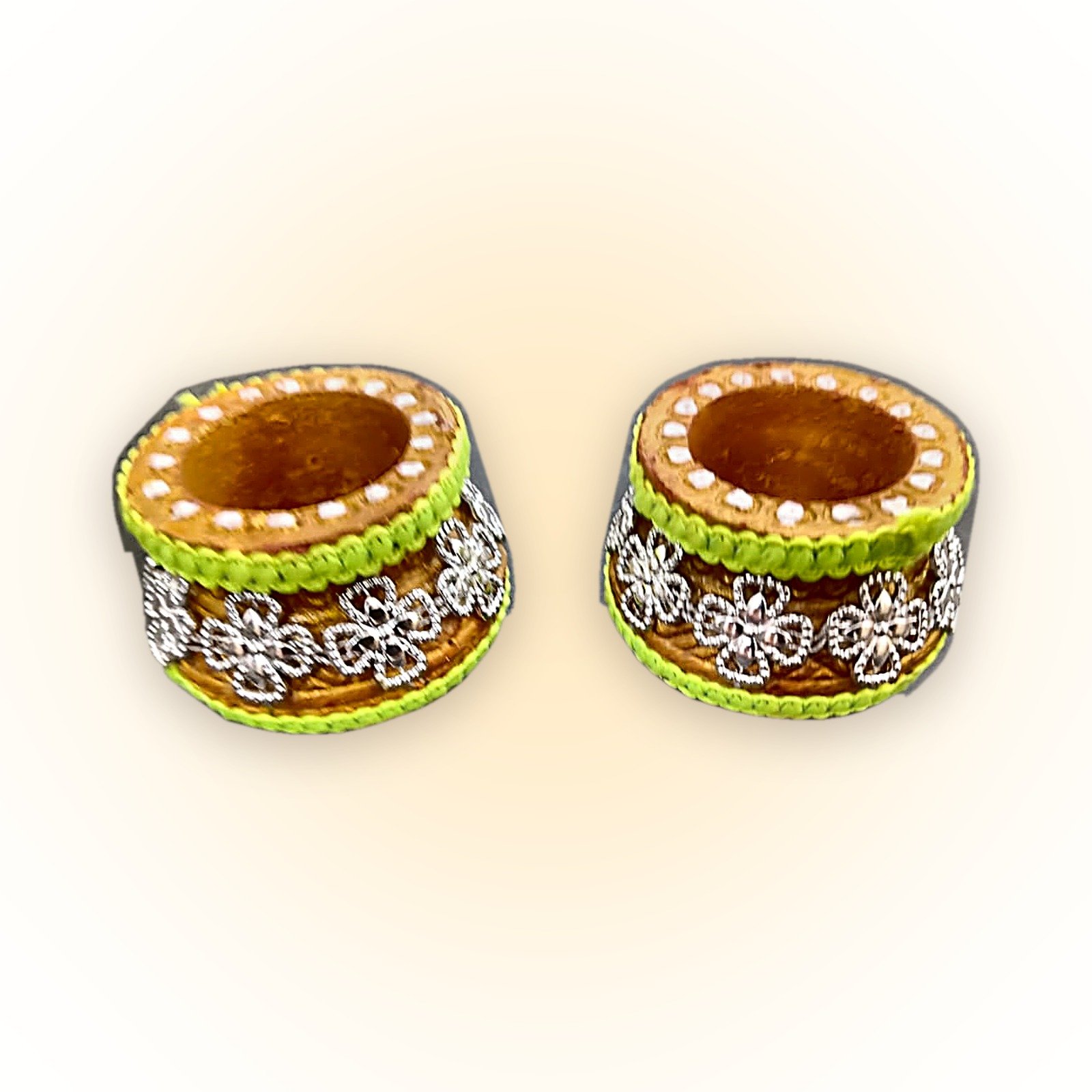 Two hand-decorated matka clay diyas