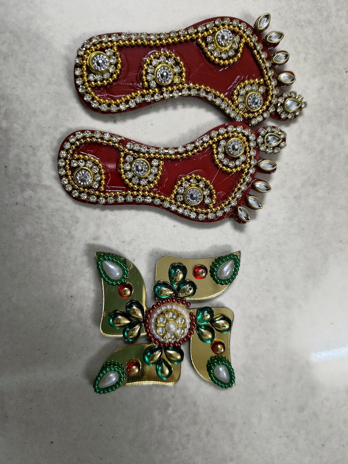 Red Laxmi pagla with kundan stones and golden swastik