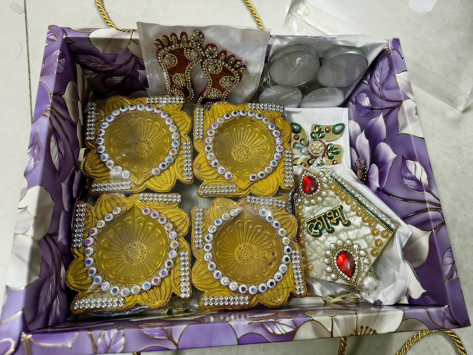 Swarna Golden Diya Hamper, open box showing all items