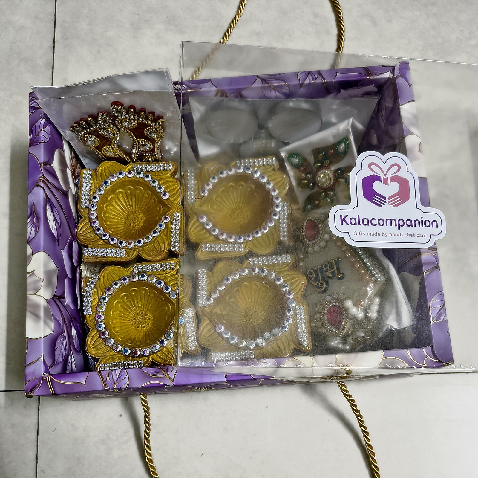 Swarna Golden Diya Hamper, packed in the floral gift box