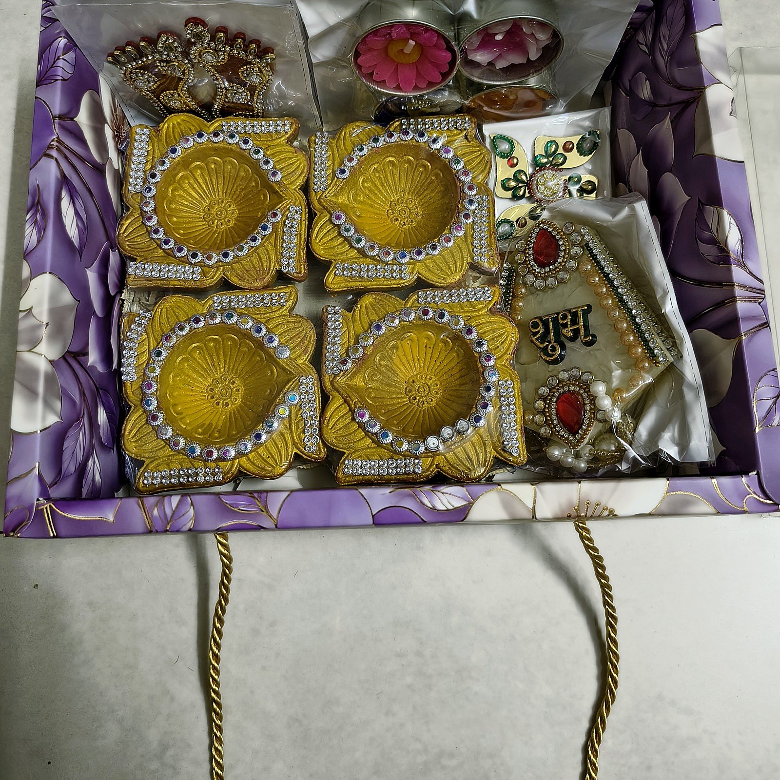 Swarna Tarang Golden Diya Hamper: open box showing all items