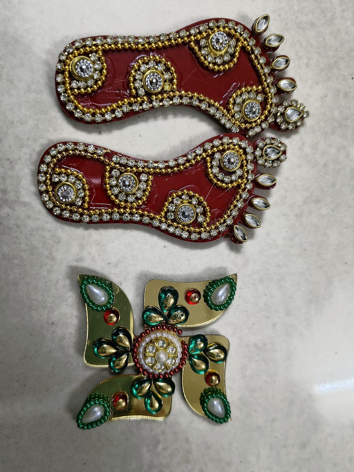 Swarna Tarang Golden Diya Hamper: Laxmi pagla and swastik