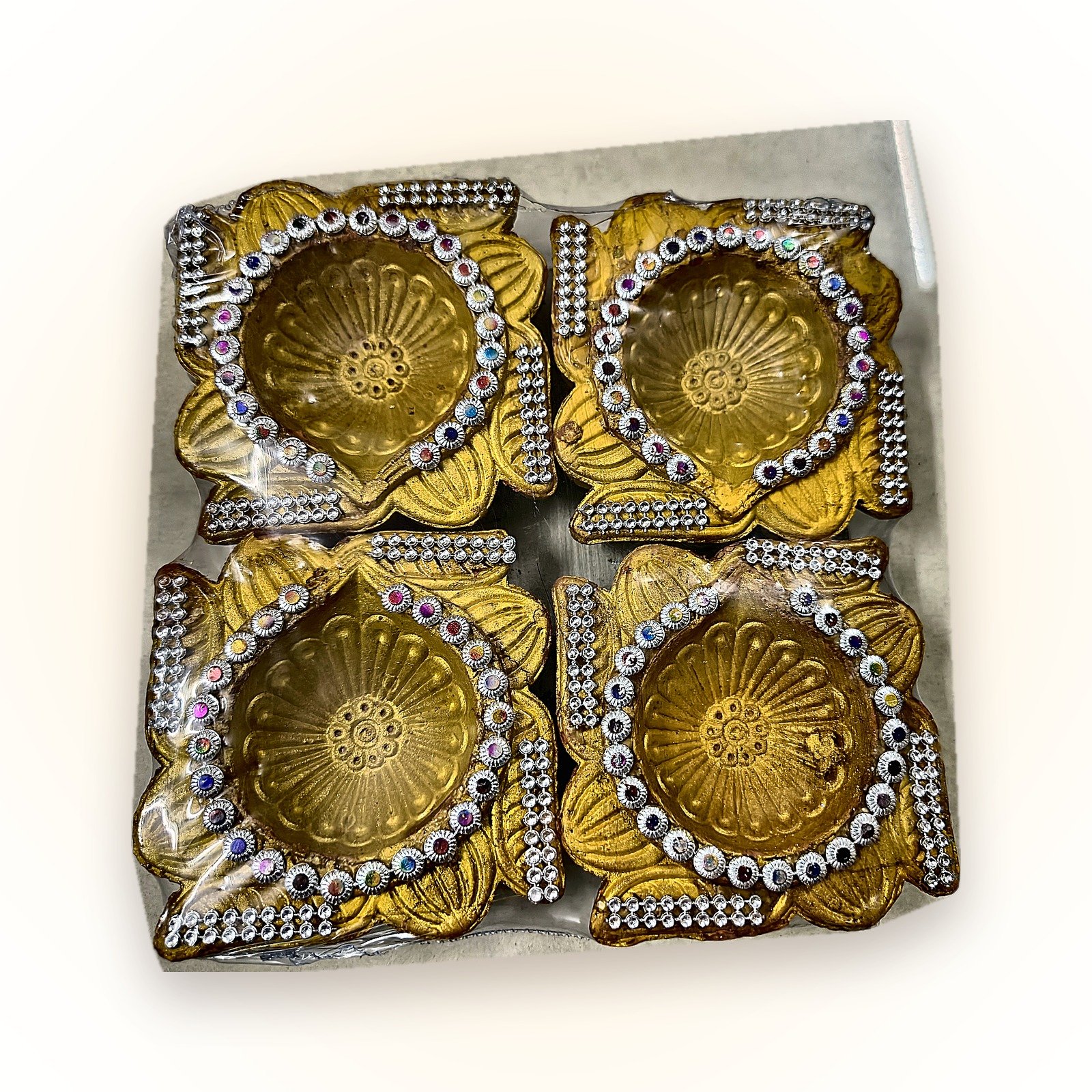 Swarna Tarang Golden Diya Hamper with Floating Candles: golden diyas